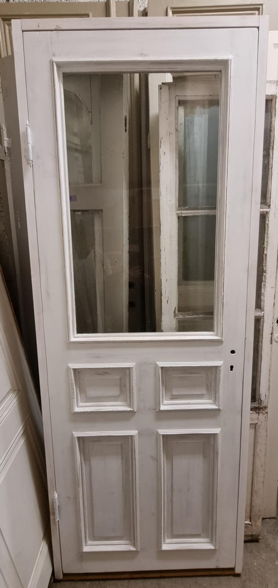 Enkeldörr med mundblåst glas och karm